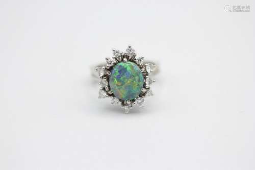 A lady’s 18kt white gold, black opal and diamond ring