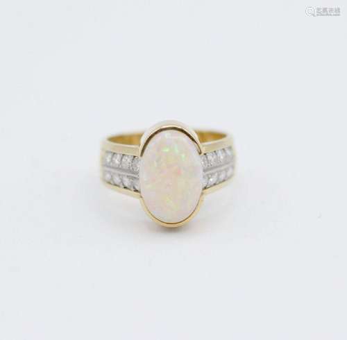 A lady’s 18kt yellow gold, opal, and diamond ring