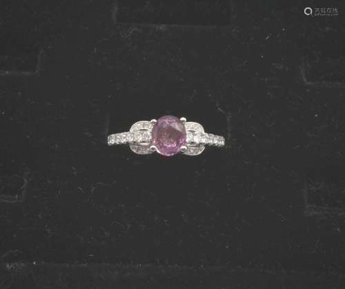 A lady's 18kt white gold pink sapphire and diamond ring, tot...