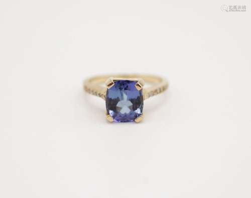 A lady's 14kt yellow gold ring and tanzanite ring, total wei...