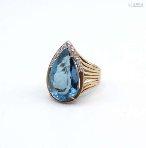 A lady’s 14kt yellow gold and rhodium plated blue topaz and ...