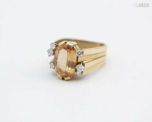 A lady’s 18kt yellow gold topaz and diamond ring