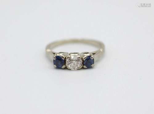 A lady's 18kt white gold, sapphire and diamond ring