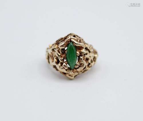 A jadeite and 14kt yellow gold ring