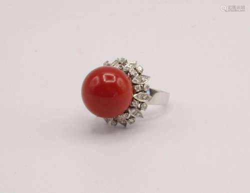 A lady's coral and diamond ring in 10kt white gold