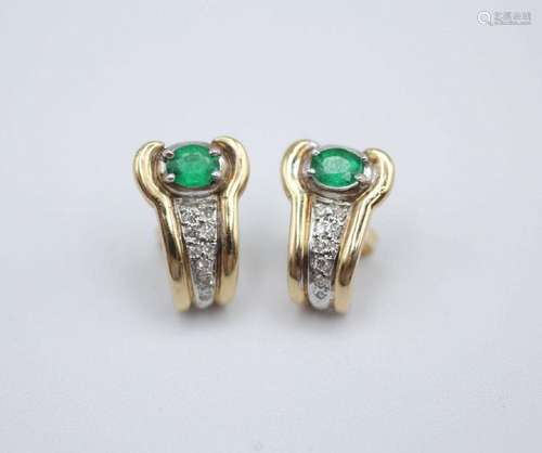 A pair of small emerald and diamond earrings