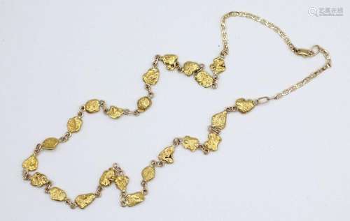 A lady’s gold chain set with 23 gold nuggets.