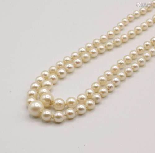 A vintage two-strand graduated pearl necklace with silver cl...