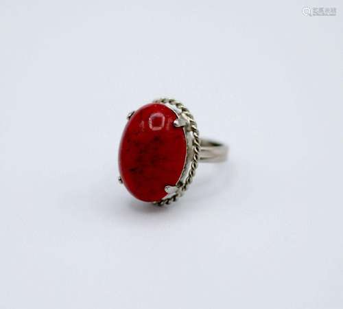 A lady's coral ring mounted in silver.