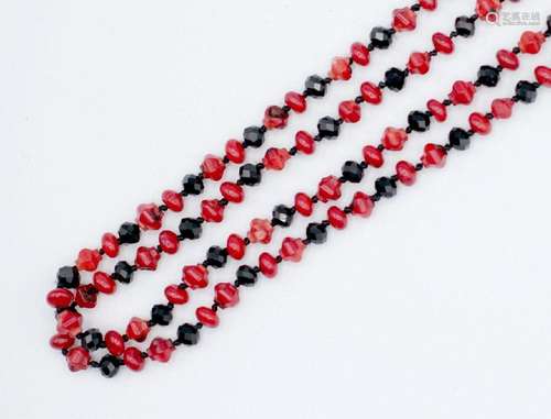 A red coral beaded necklace. 24 1/2 in. (62.23 cm.) l.