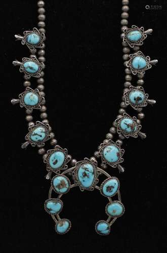 A Navajo silver and turquoise squash blossom necklace. 10 in...