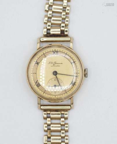 An English 9kt gold man's wrist watch and strap