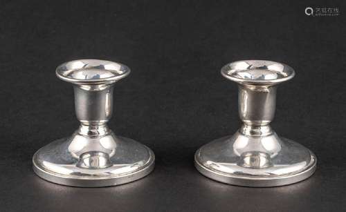 A pair of Birks sterling short candlesticks.