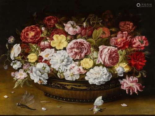 Still life of roses in an oriental lacquer and canework bowl...