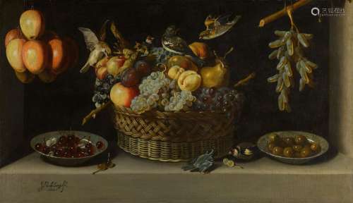 Still life with a basket of fruit with two plates of fruit a...