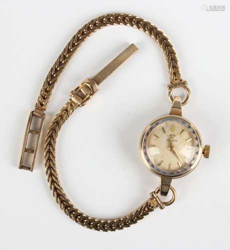 An Omega 9ct gold circular cased lady's wristwatch, the sign...