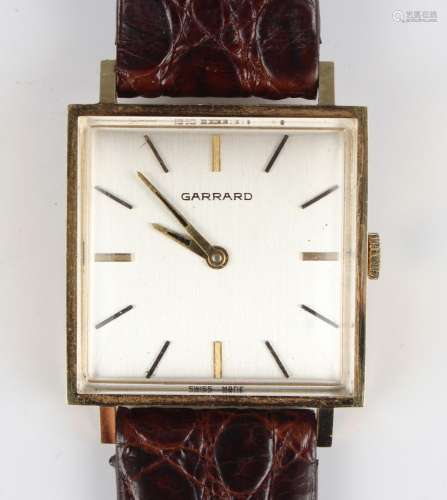 A Garrard 18ct gold square cased gentleman's wristwatch, the...