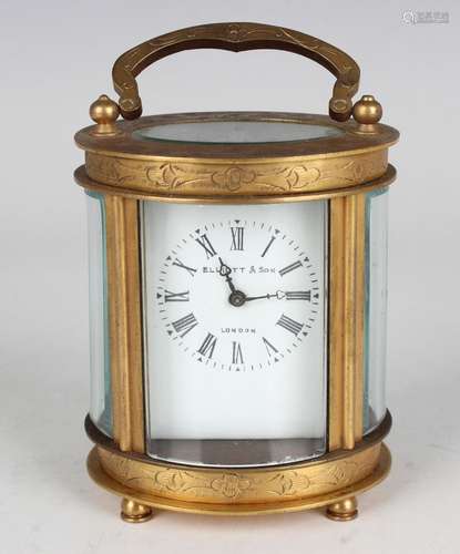 A 20th century Chinese brass oval cased carriage timepiece, ...