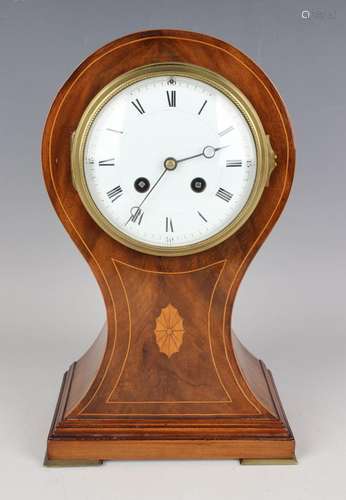 An Edwardian mahogany balloon cased mantel clock with French...