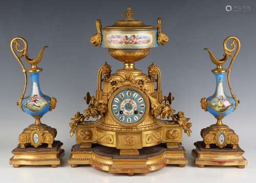 A late 19th century French gilt metal and porcelain mantel c...