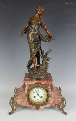 An early 20th century French rouge marble and spelter mantel...