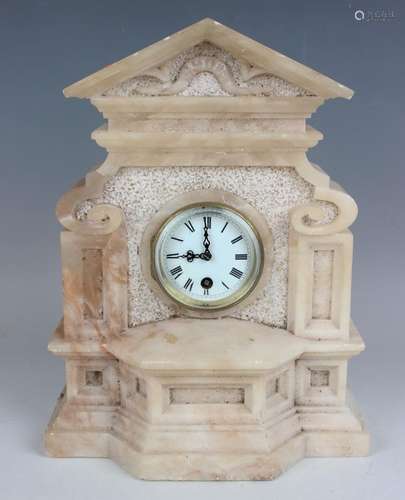 A late 19th century alabaster cased mantel timepiece, the mo...