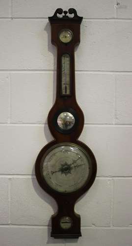 An early 19th century mahogany wheel barometer with silvered...