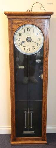 A George V National Electric oak cased electric master clock...