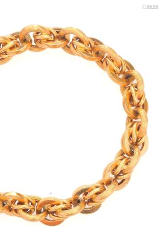 Bracelet en or jaune 18k (750 millièmes), formé d`une maille...