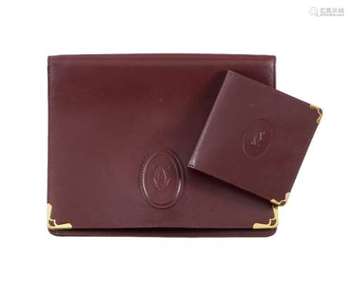 Cartier, pochette dragone et portefeuille Must de Cartier cu...