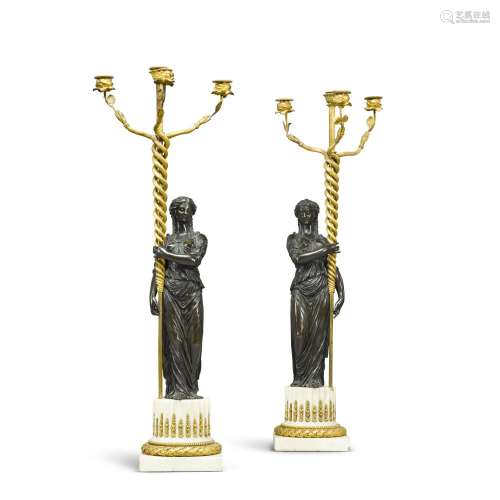 A pair of Louis XVI gilt and patinated bronze four-light can...