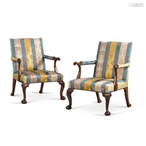 A pair of George II carved walnut library armchairs, mid-18t...