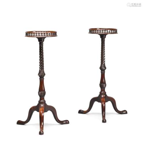 A pair of George III carved mahogany torchères, circa 1760