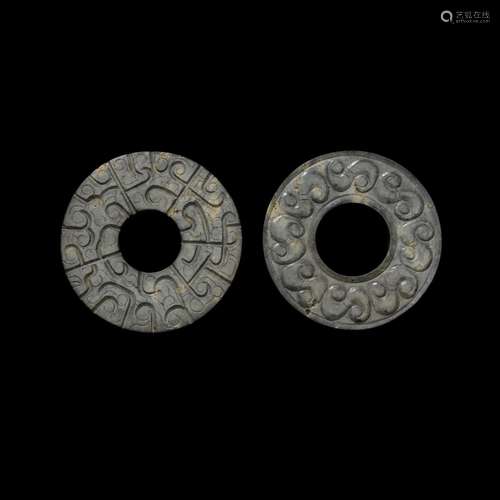 A matched pair of dark grey jade rings, Eastern Zhou dynasty...