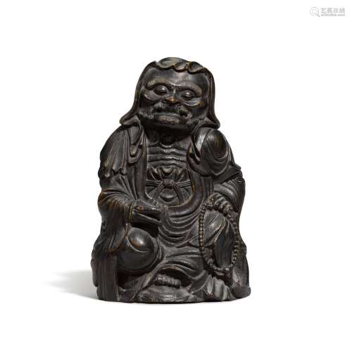 A bamboo carving of a seated monk, Qing dynasty, 18th centur...