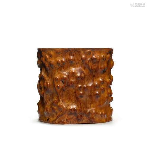 A large huanghuali `tree trunk` brushpot, Qing dynasty, 17th...