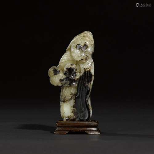 A mottled grey and black jade figure of a foreigner, Yuan dy...