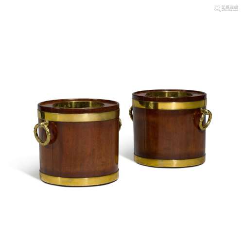 A pair of George III brass bound mahogany wine coolers, last...