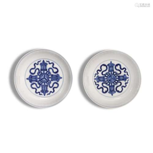 A rare pair of blue and white `double vajra` dishes, Marks a...