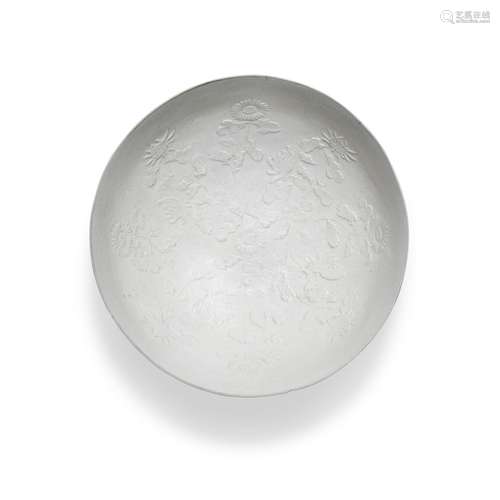 A moulded Ding-type bowl, Ming dynasty | 明 定式白釉印花卉紋...