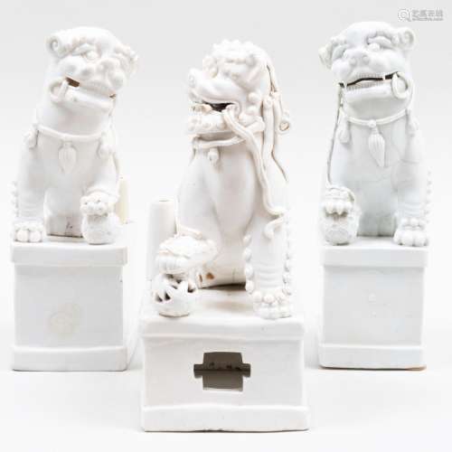 Group of Three Chinese White Glazed Porcelain Buddhistic Lio...