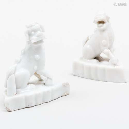 Two Miniature Chinese Porcelain Buddhistic Lions