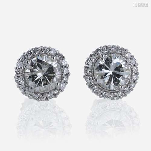 A Pair of 18K White Gold Halo Diamond Stud Earrings