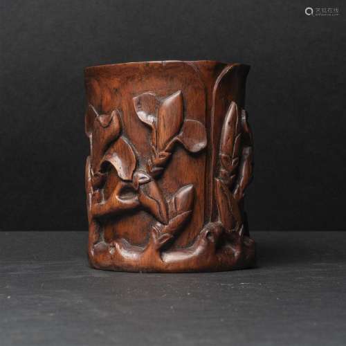 A Carved Huanghuali Orchid-Form Brush Pot, 19th/20th Centur