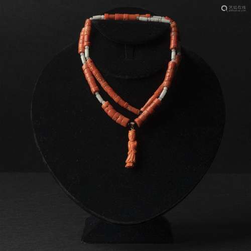 A Carved Coral Necklace With a Carved Coral 'Beauty' Figura