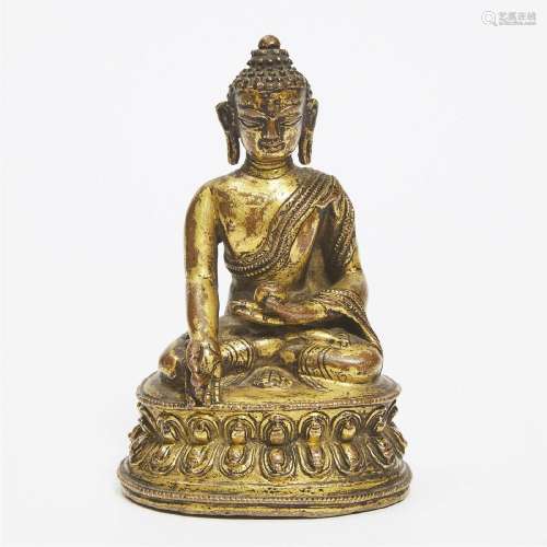 A Gilt Copper Alloy Figure of Medicine Buddha, Nepal, 14th
