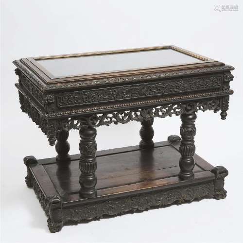 A Chinese Export Carved Hardwood Display Table, Late 19th/E