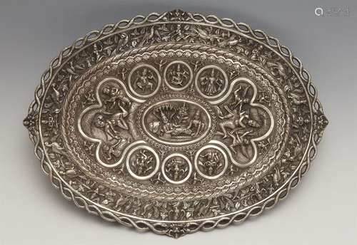 A Poona oval silver swami pattern footed tray. Late 19th cen...