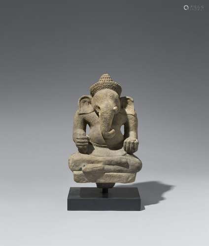 An Angkor Wat-style sandstone figure of a seated Ganesha. Ca...