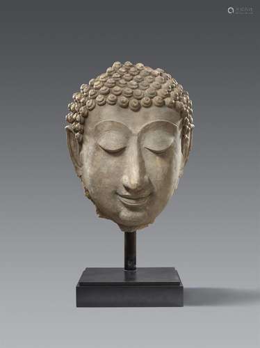 A monumental Sukhothai stucco head of a Buddha, Thailand. 14...